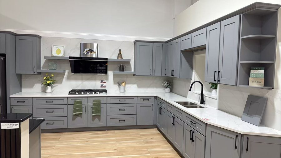 Gray Shaker kitchen display with quartz countertops in the showroom