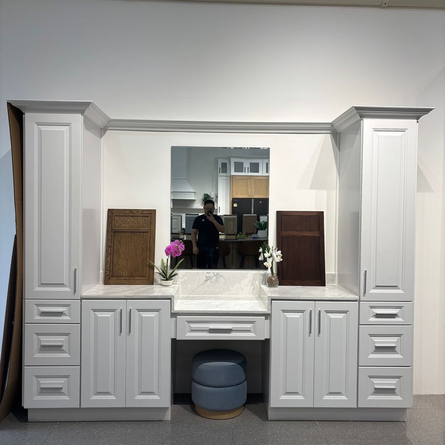 White bathroom vanity on display with cabinet door samples