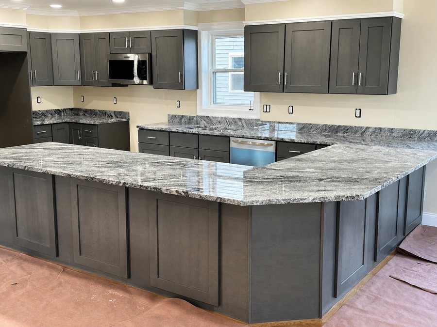 Grey shaker kitchen with a granite peninsula and island